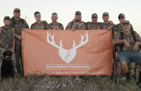 photo-of-men-with-jbf-flag-jared-burke-foundation